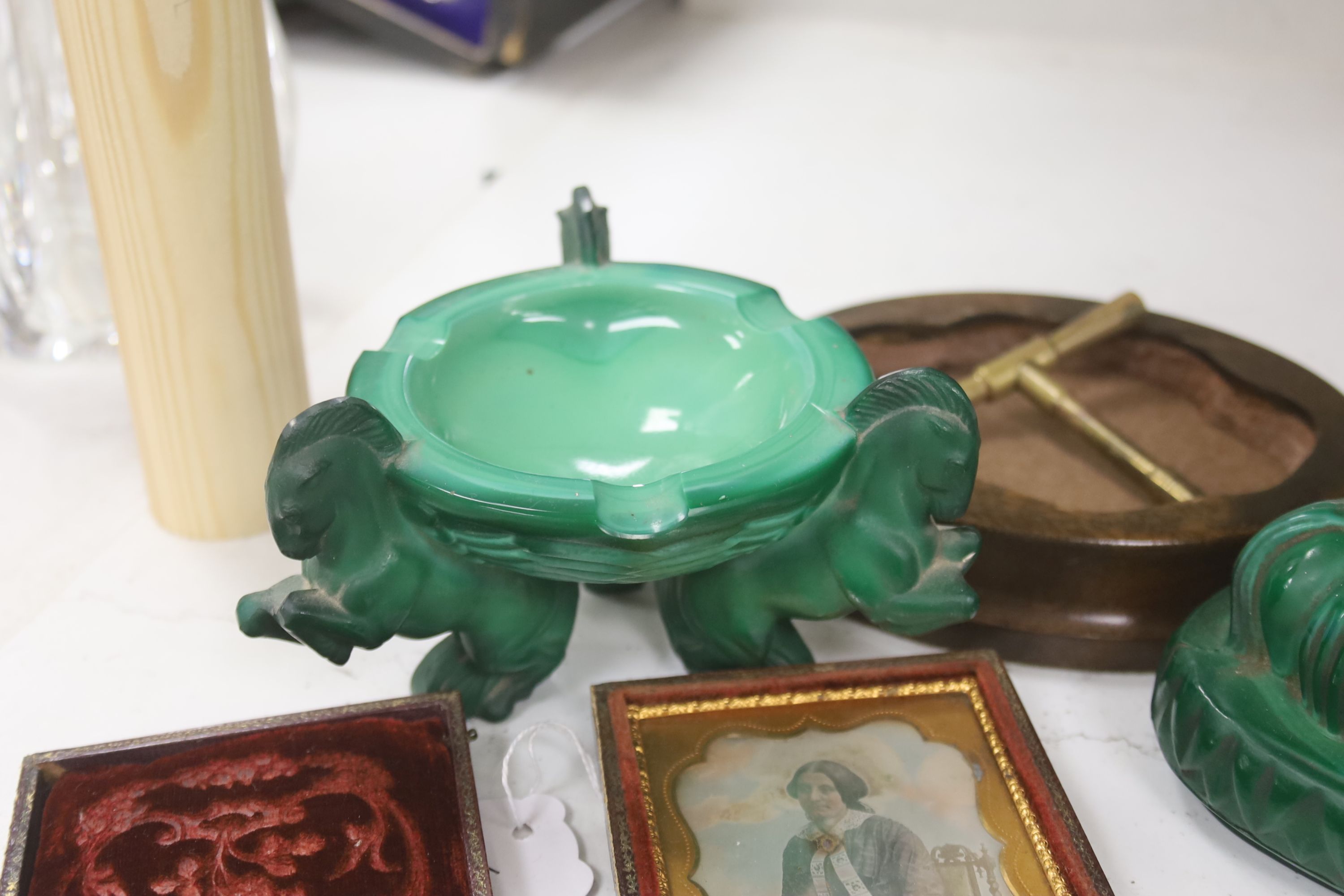 A French Art Deco green glass ashtray, a similar green glass Buddha, two magnifying glasses and a Daguerreotype portrait of a Victorian lady